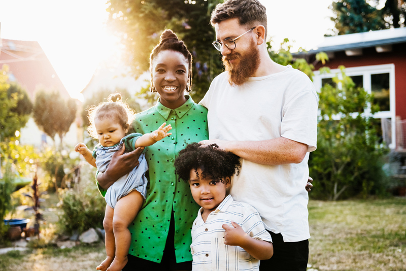 A family outside enjoying the sun