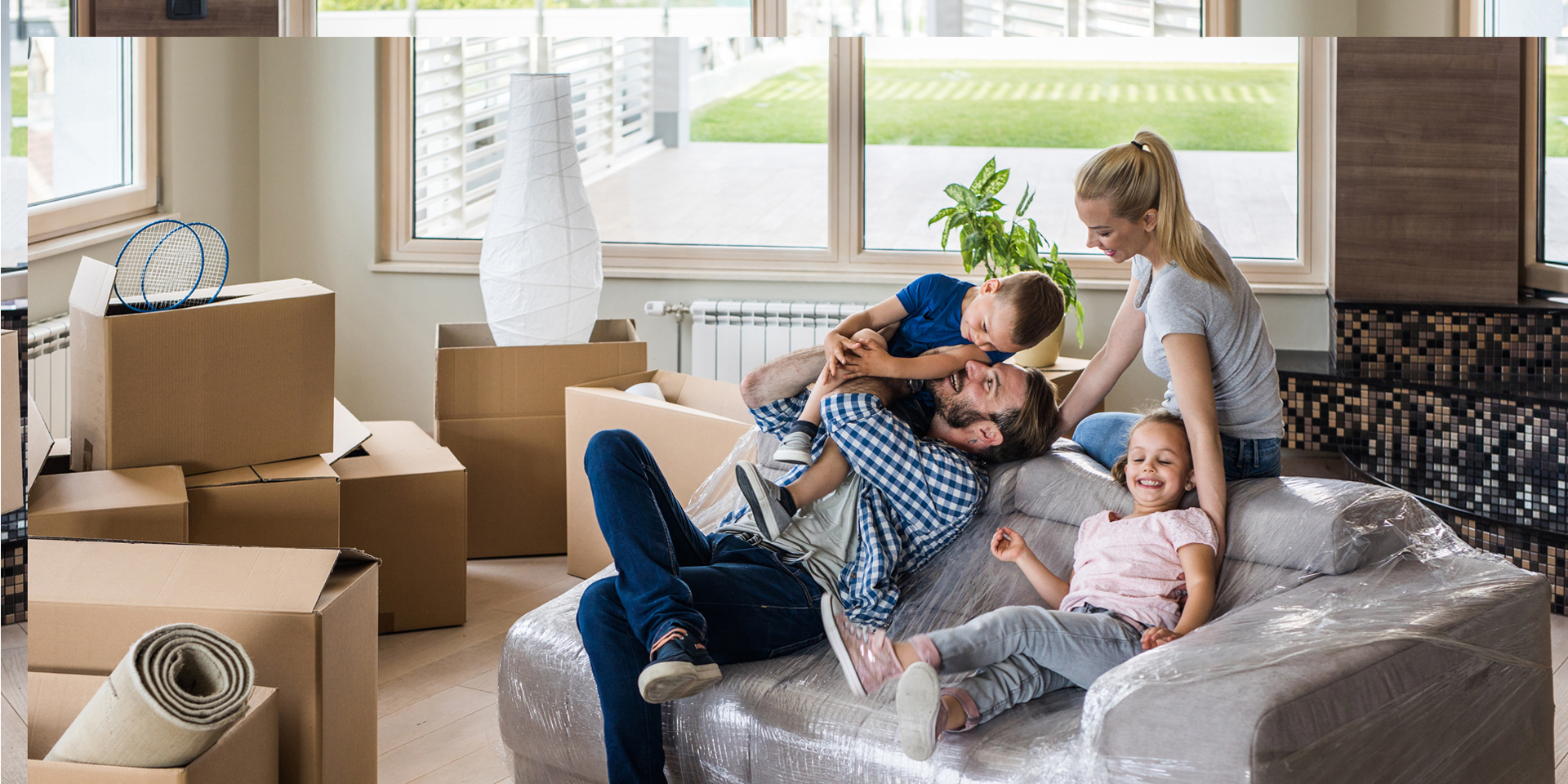 A family on the couch playing